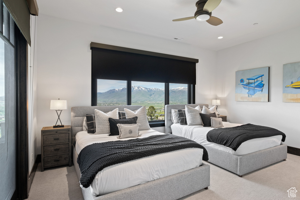 Carpeted bedroom with a mountain view, recessed lighting, and a ceiling fan