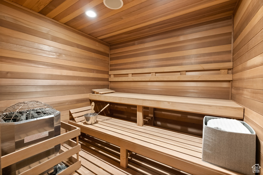 Sauna / steam room with wooden ceiling and wooden walls