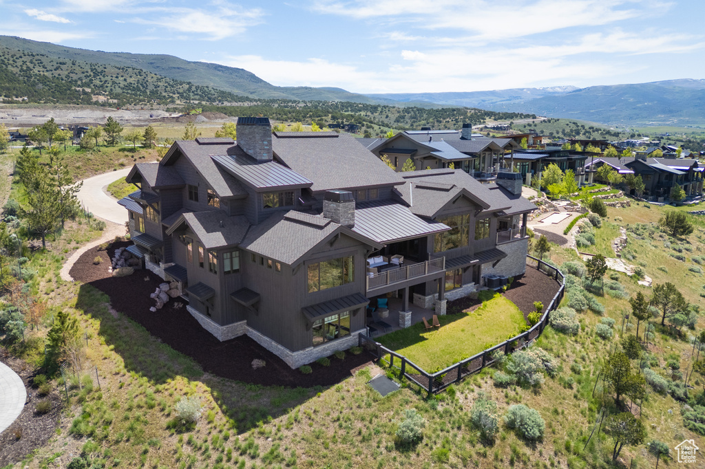Aerial view of residential area featuring a mountainous background