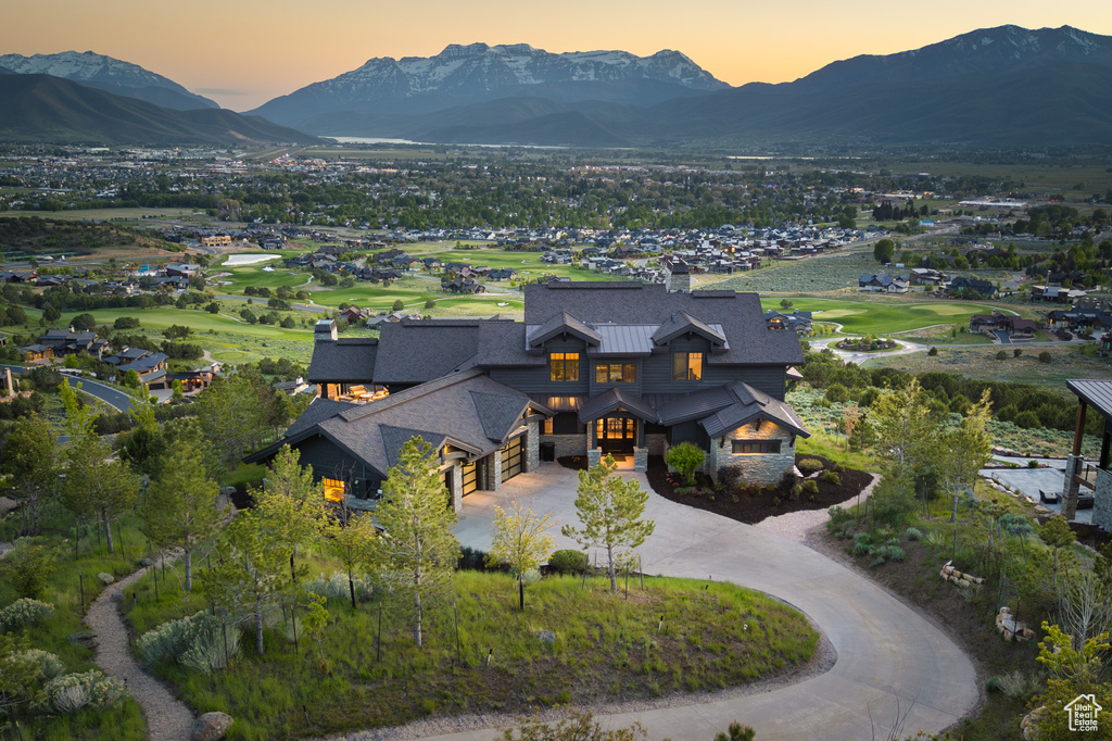 Aerial view at dusk of a mountain view and view of golf course
