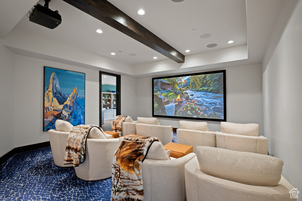 Cinema room featuring recessed lighting, beam ceiling, dark colored carpet, and baseboards