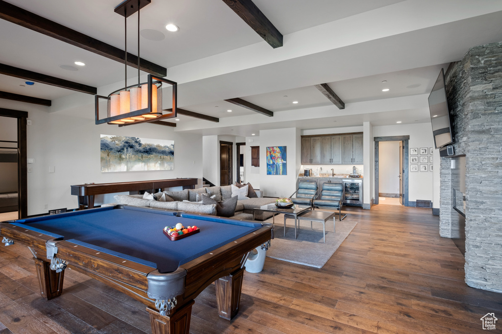 Recreation room featuring beamed ceiling, wood finished floors, billiards table, wine cooler, and recessed lighting