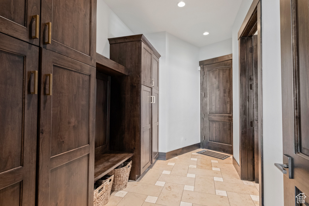 Mudroom with baseboards and recessed lighting