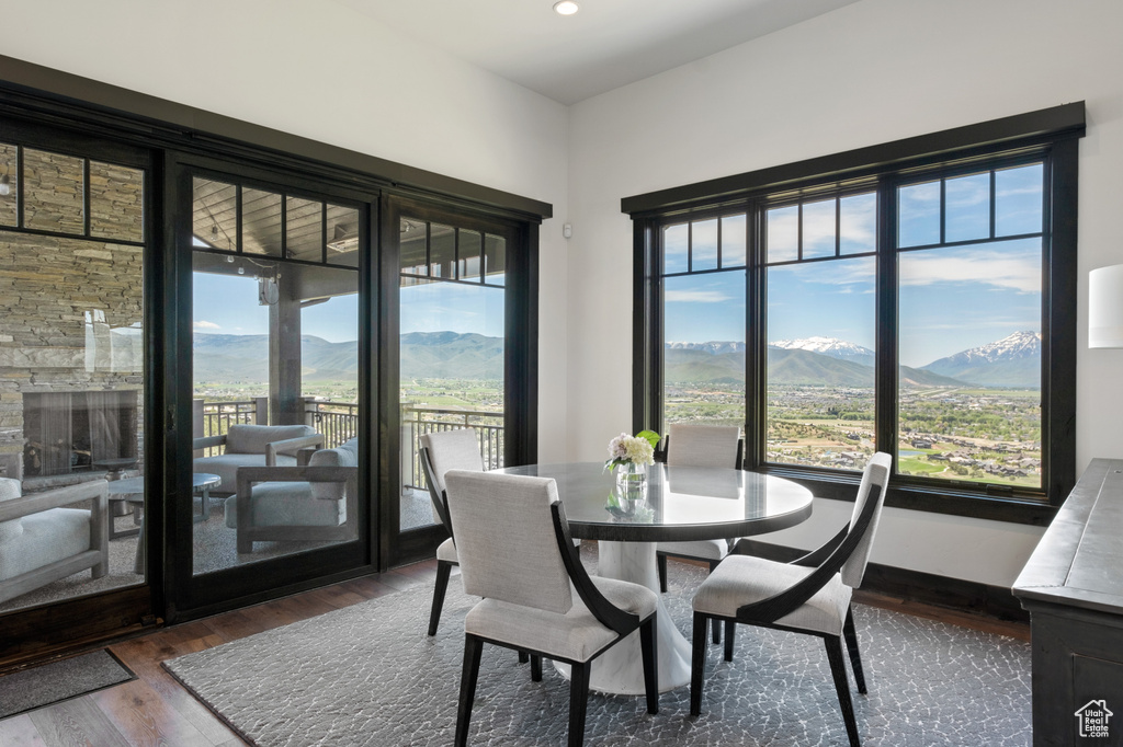 Dining room featuring a mountain view, wood finished floors, and recessed lighting