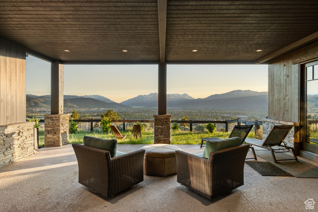 View of patio featuring a mountain view and an outdoor hangout area