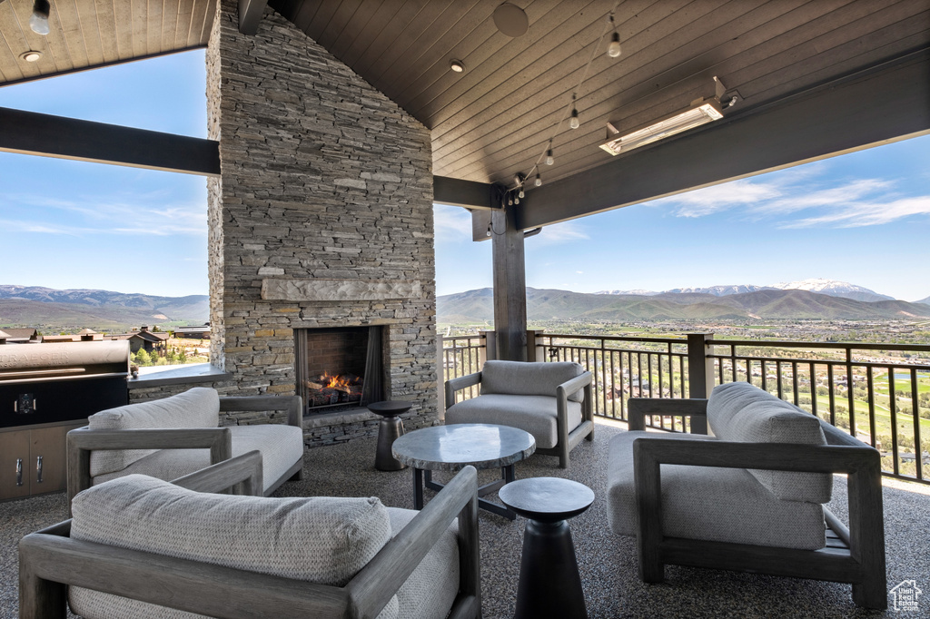 View of patio / terrace featuring a mountain view and an outdoor living space with a fireplace