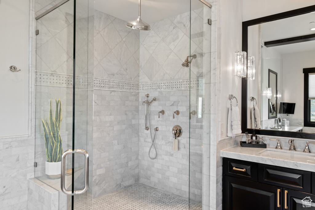 Bathroom with vanity and a stall shower