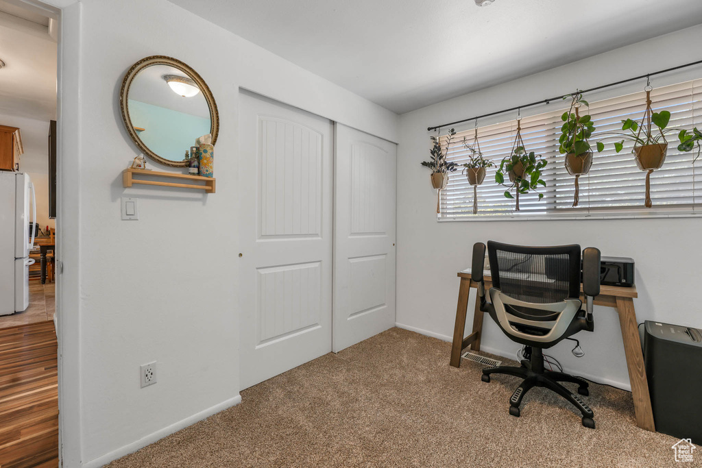 Carpeted office with baseboards
