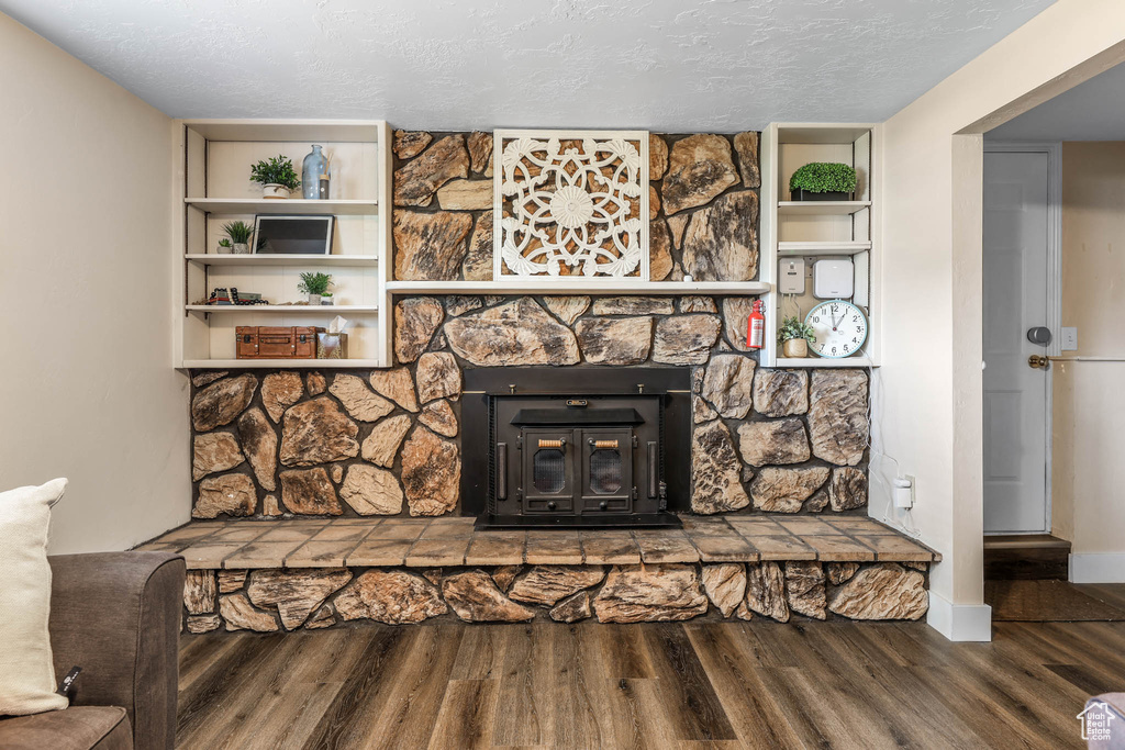 Detailed view of wood finished floors and a textured ceiling