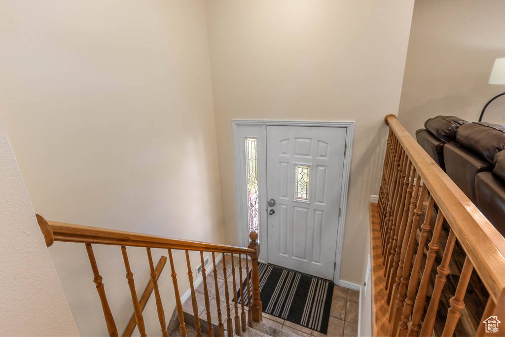 Entryway featuring baseboards and tile patterned floors