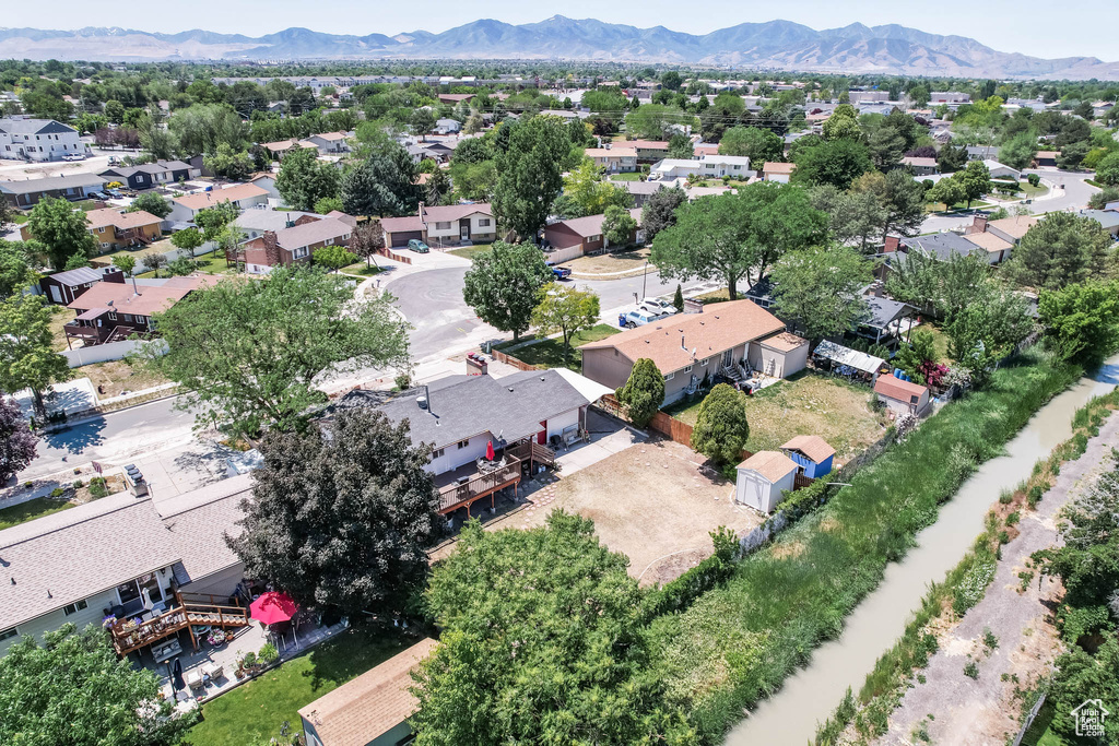Aerial perspective of suburban area featuring a mountainous background