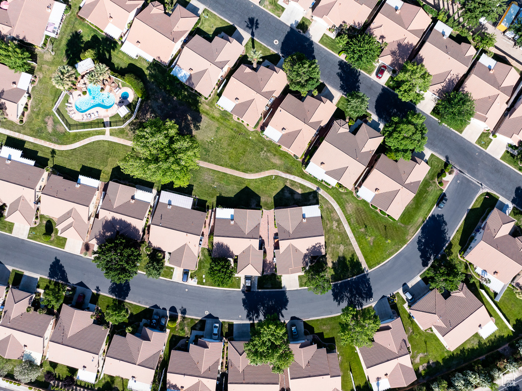 Aerial overview of property's location featuring nearby suburban area and a pool