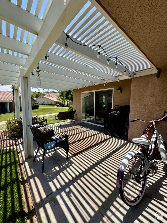 View of patio with a pergola