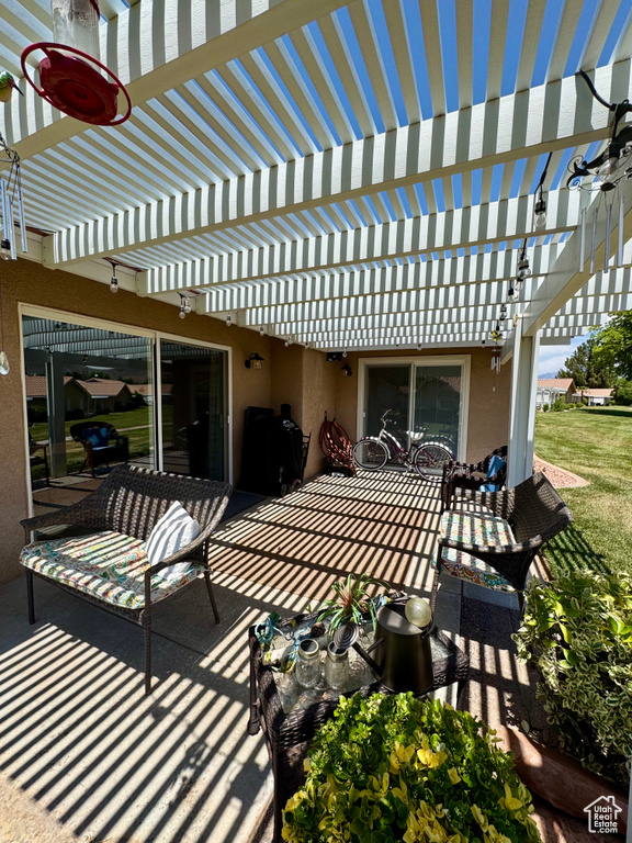View of patio with a pergola