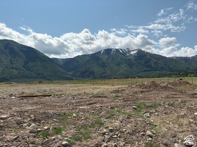 View of mountain background featuring rural landscape