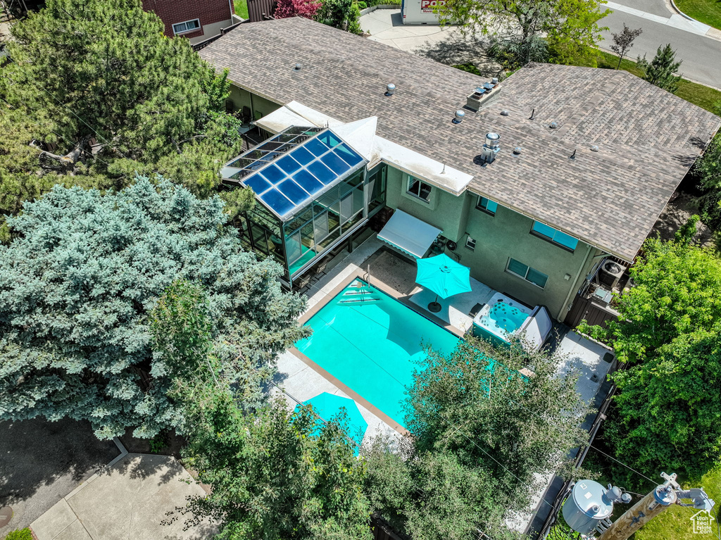 View of subject property with a pool area