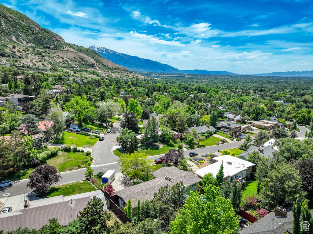 Aerial view of residential area featuring mountains