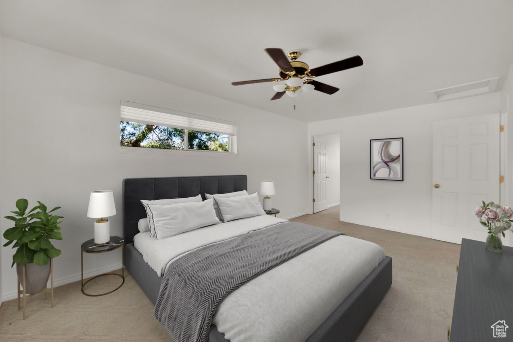 Bedroom with carpet flooring, attic access, a ceiling fan, and baseboards