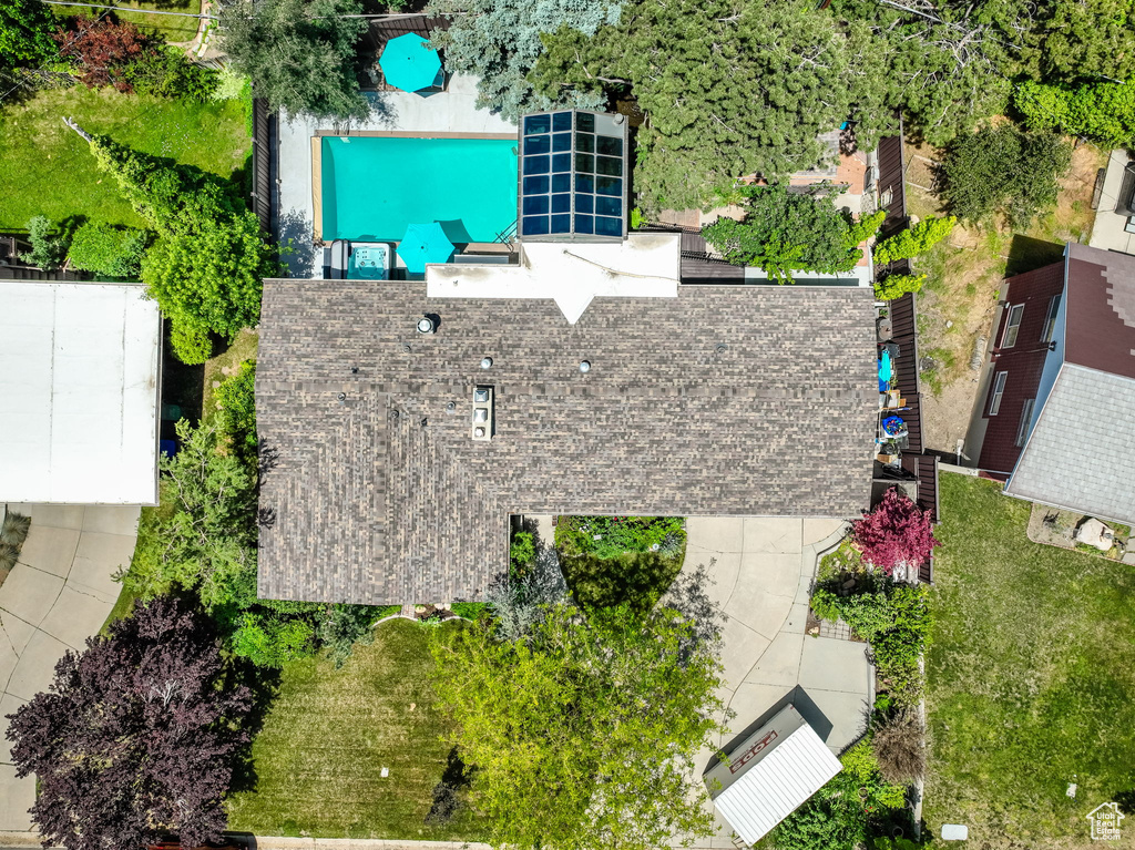 View of subject property featuring a pool