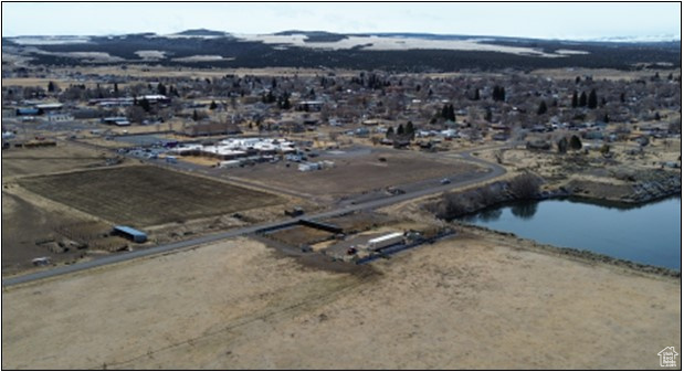 Aerial overview of property's location with a water and mountain view