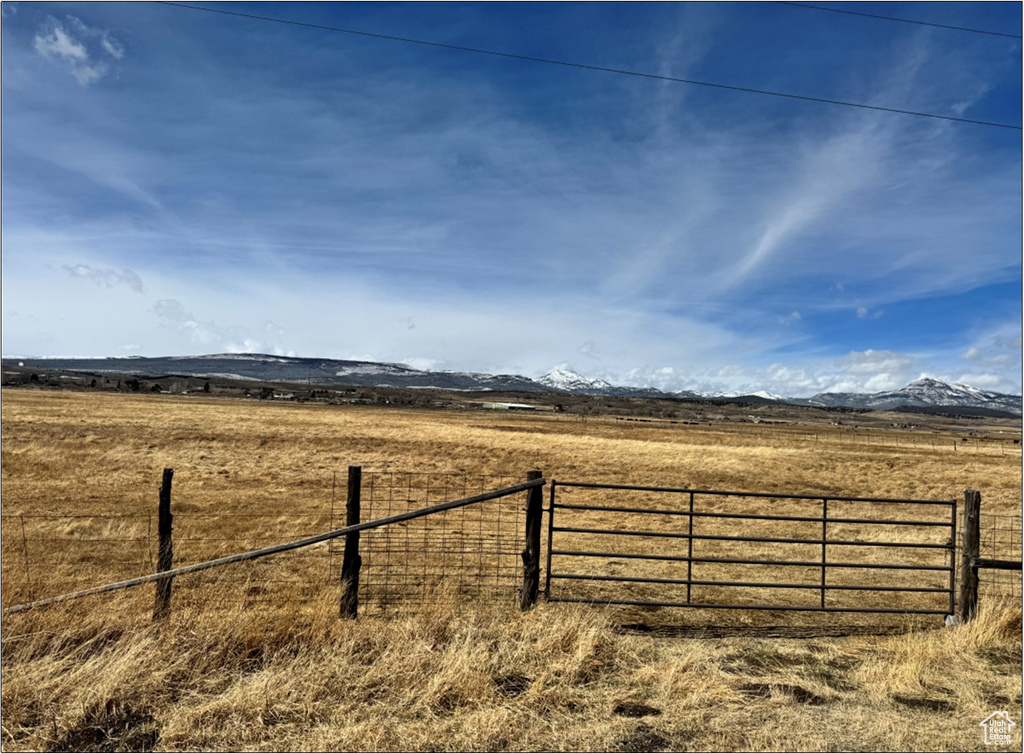 View of yard featuring a view of countryside and a mountain view