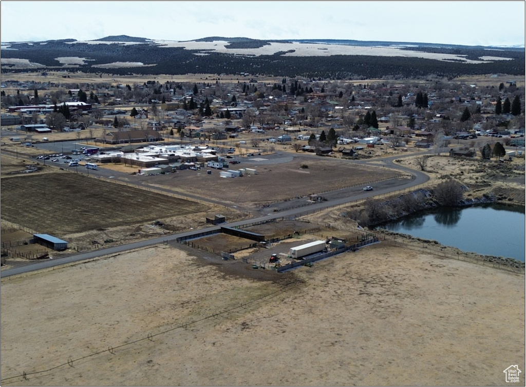 View of property location featuring a water and mountain view