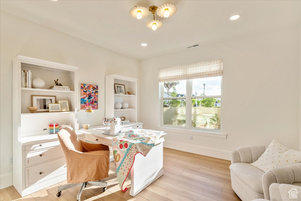 Office with light wood-style floors, baseboards, and recessed lighting