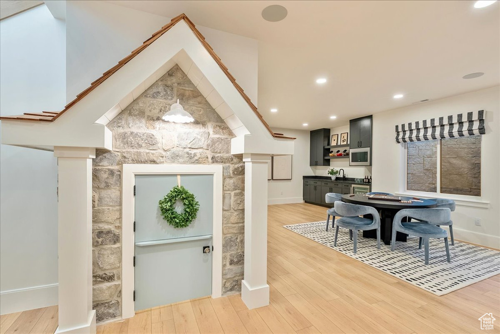 Dining space featuring baseboards, light wood finished floors, and recessed lighting
