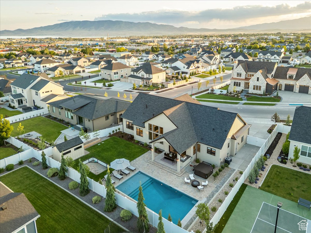 Aerial perspective of suburban area featuring a mountain backdrop