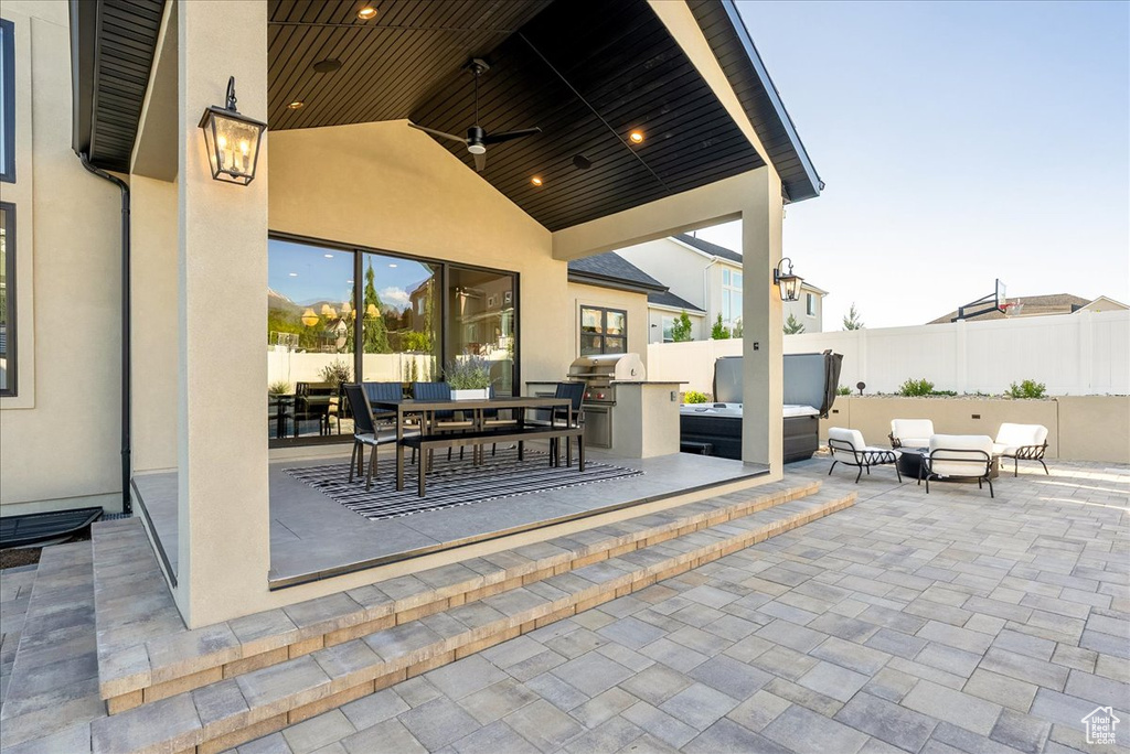 View of patio featuring area for grilling, an outdoor living space, a ceiling fan, and outdoor dining space