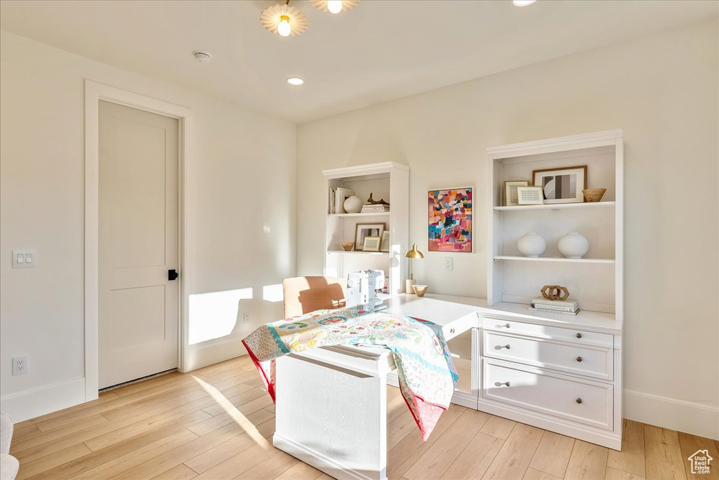 Office area with light wood-type flooring, recessed lighting, and baseboards