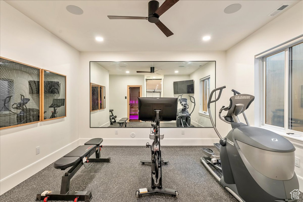 Exercise room featuring a ceiling fan, recessed lighting, and baseboards