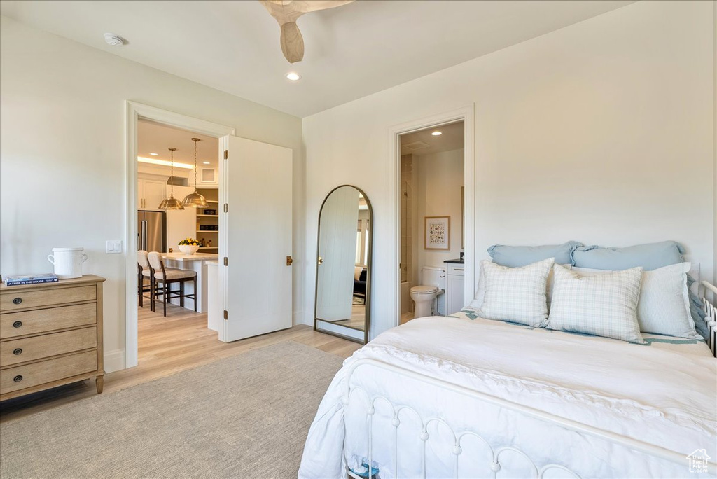 Bedroom featuring light wood-style floors, recessed lighting, and ensuite bathroom