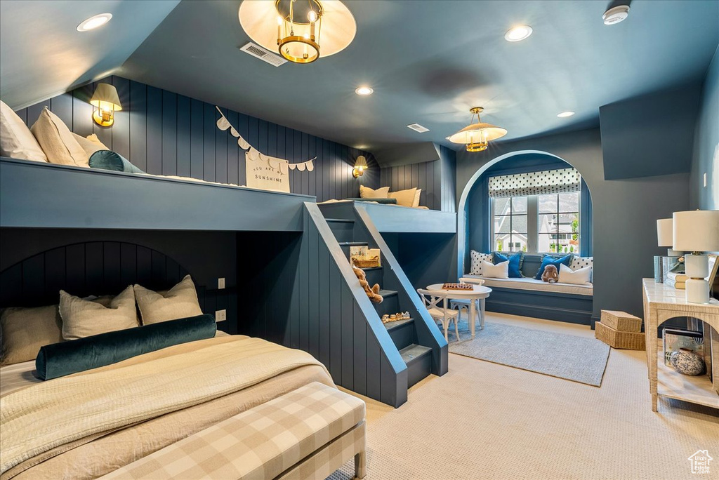 Carpeted bedroom with recessed lighting and vaulted ceiling