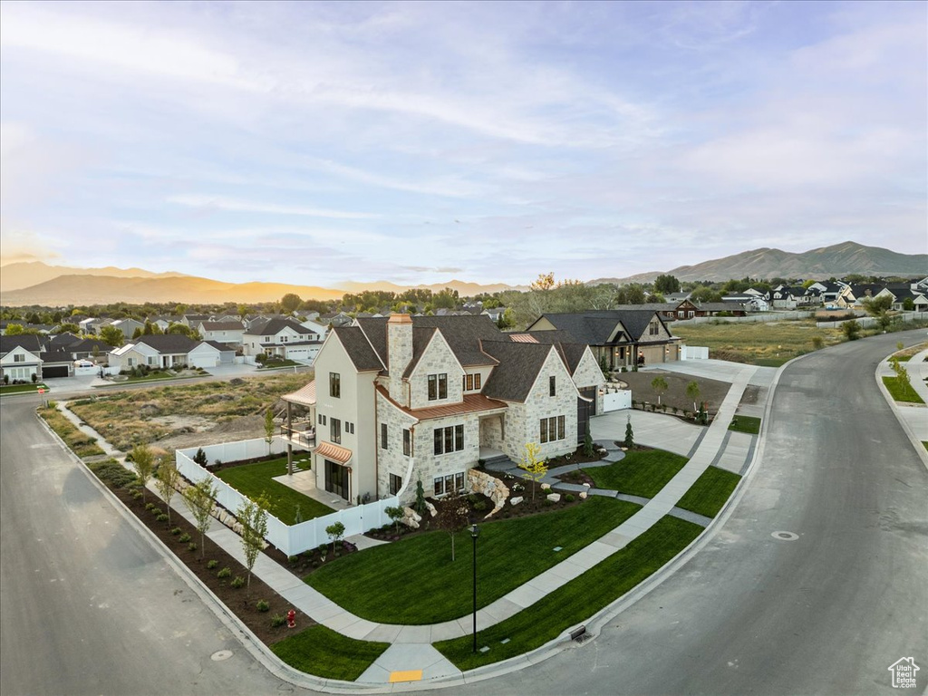 Aerial view of residential area featuring a mountain backdrop