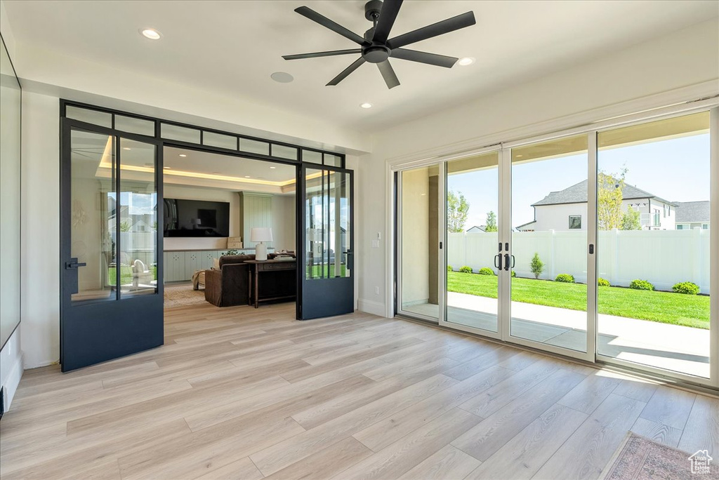 Unfurnished sunroom with french doors