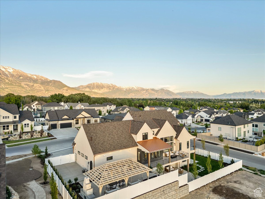 Aerial view of residential area featuring a mountainous background