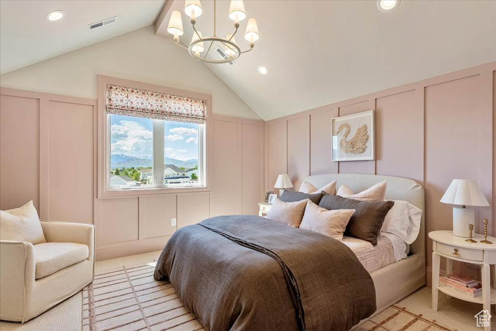 Bedroom with a decorative wall, a chandelier, vaulted ceiling, light carpet, and recessed lighting