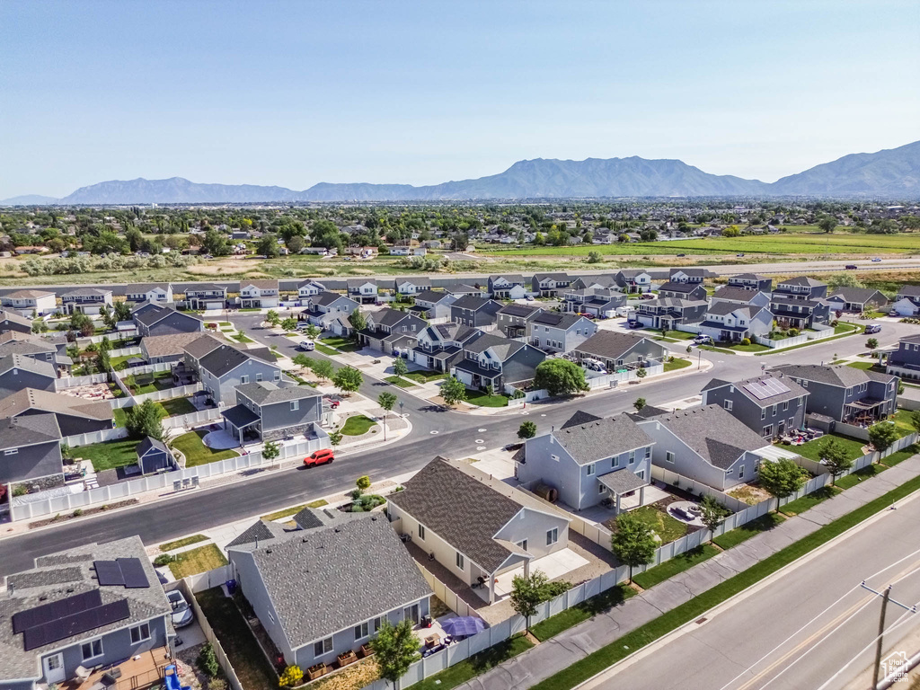 Aerial view of residential area featuring a mountainous background