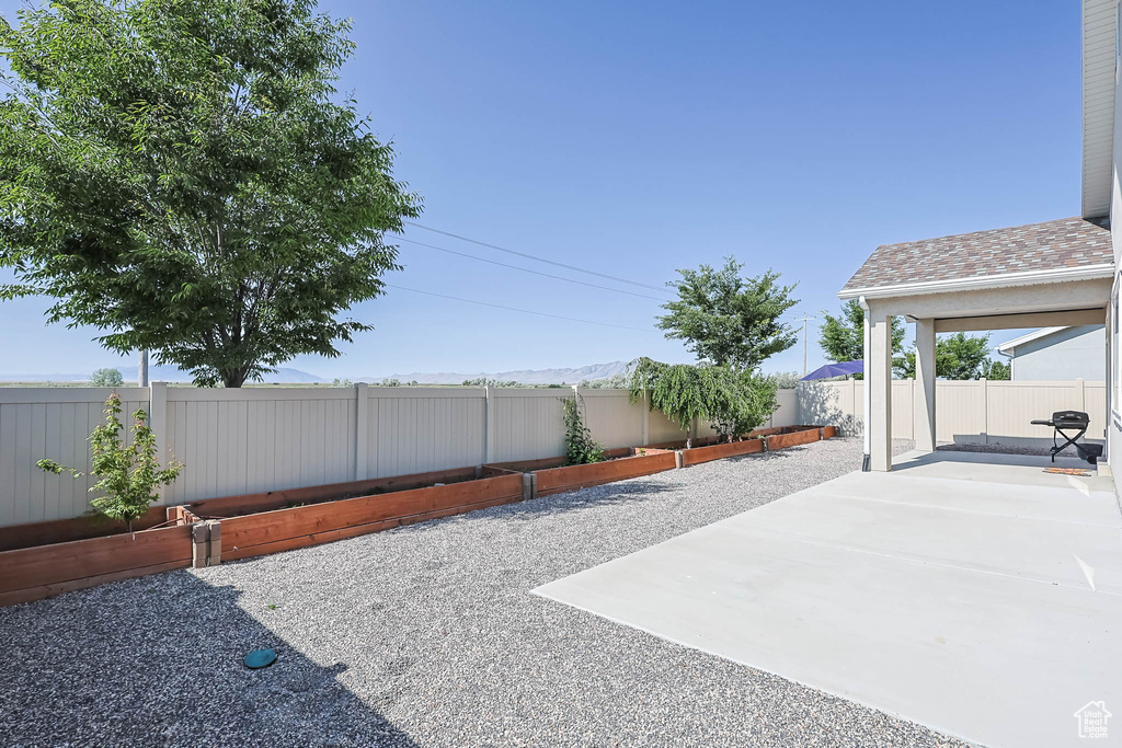 Fenced backyard with a patio area