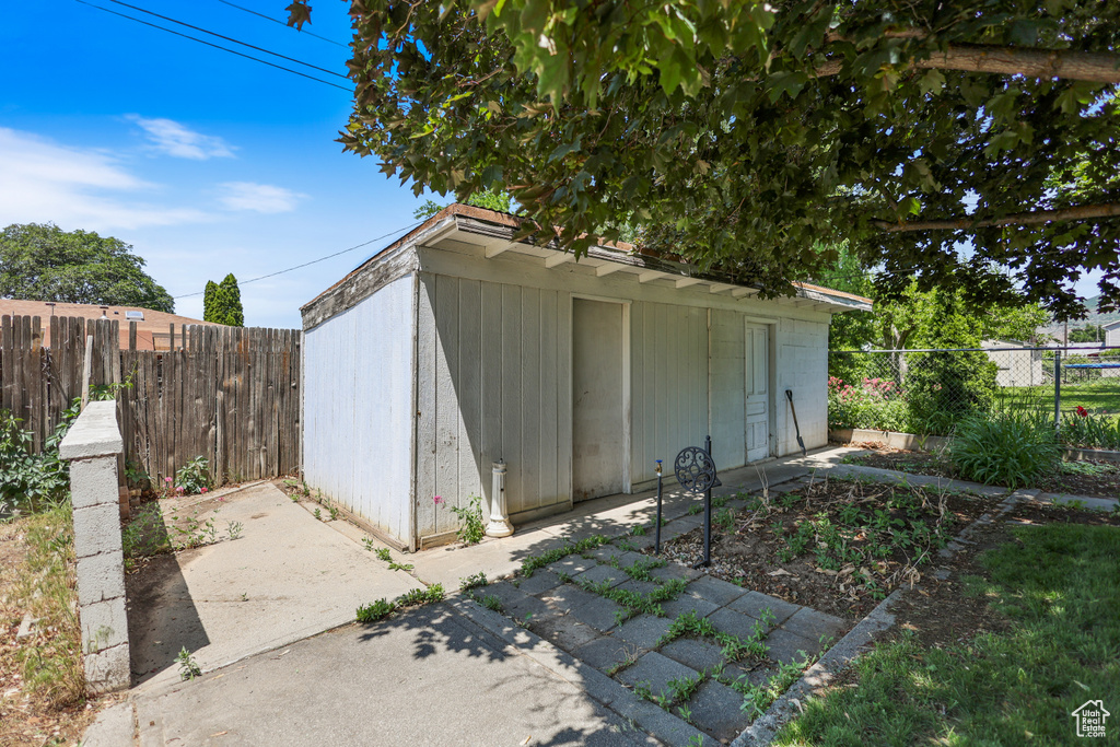 View of outdoor structure featuring a fenced backyard