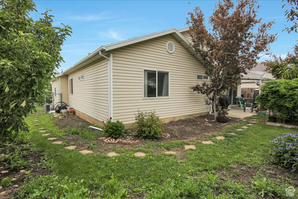 View of property exterior featuring a patio