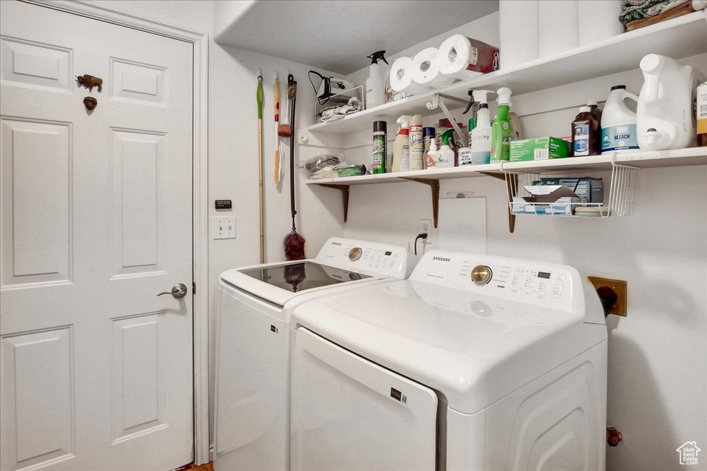 Laundry room with washer and clothes dryer