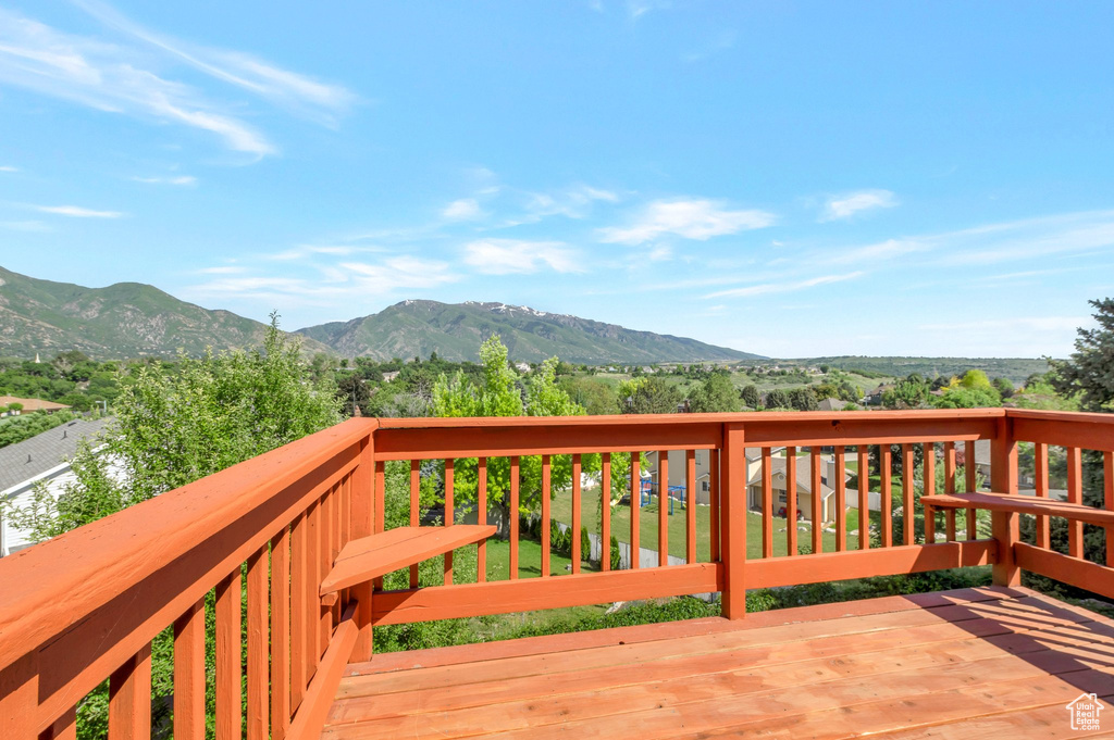 Wooden deck featuring a mountain view