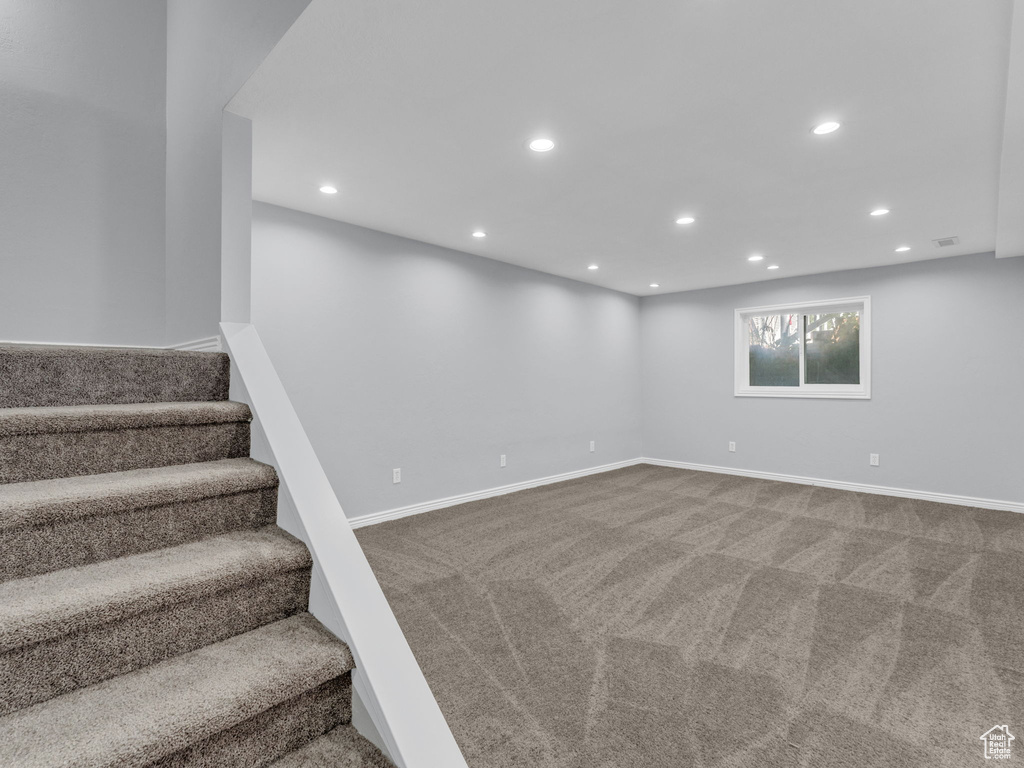 Basement featuring recessed lighting, carpet flooring, stairway, and baseboards