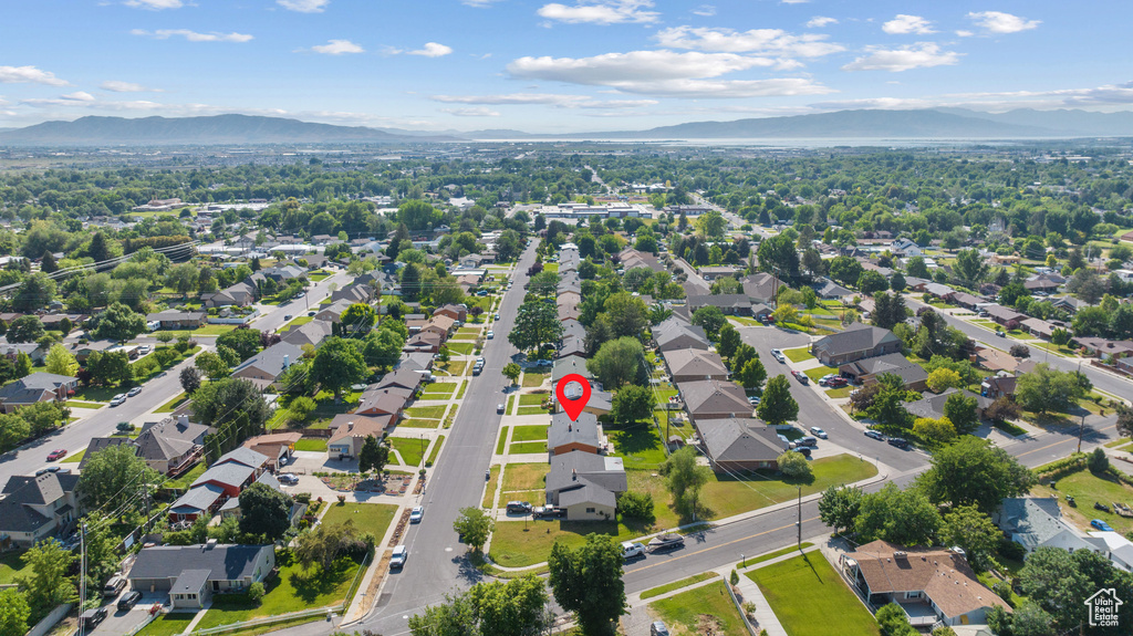 Aerial view of residential area featuring a mountain backdrop