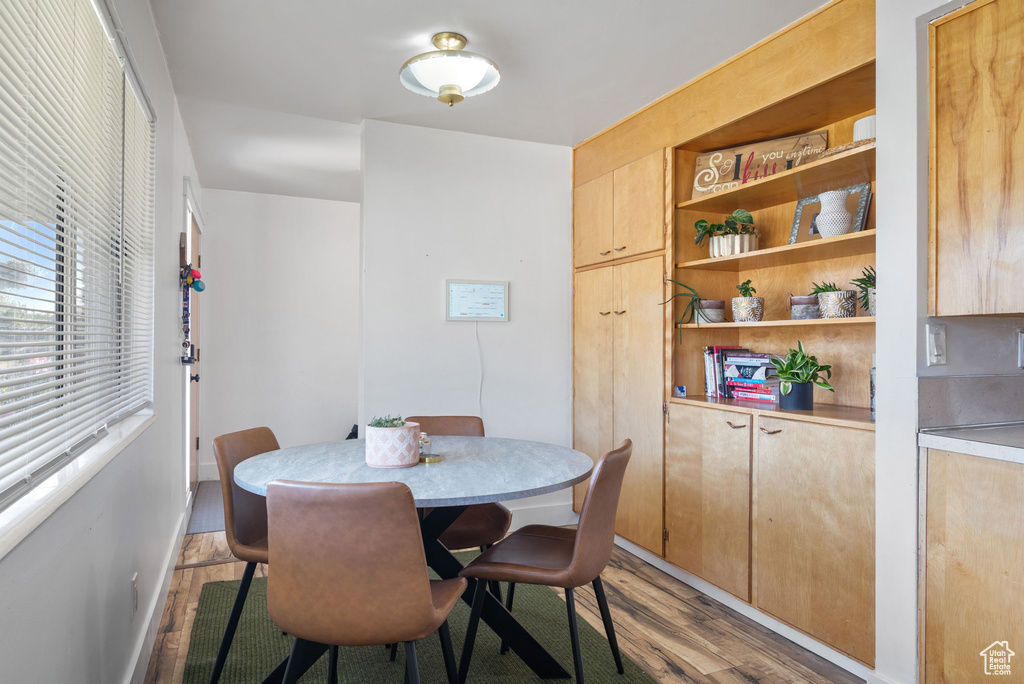 Dining area featuring wood finished floors