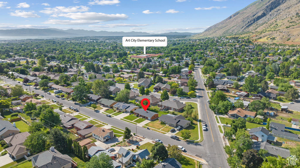 View of property location with mountains and nearby suburban area