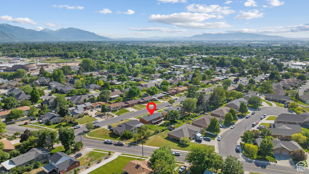 Aerial perspective of suburban area with a mountainous background