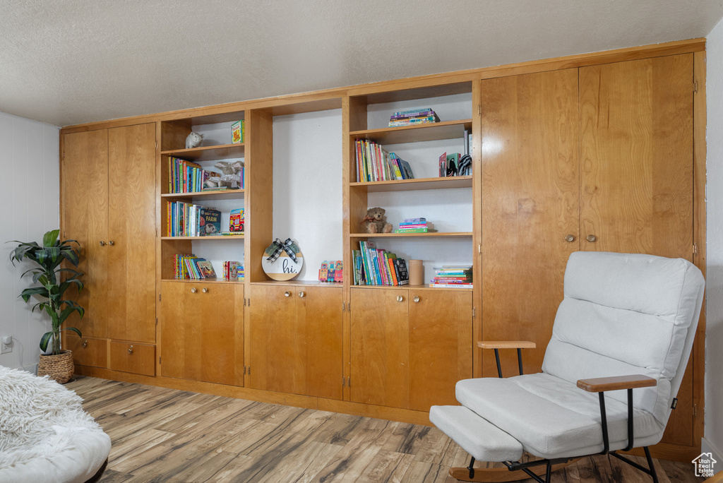 Living area with light wood-style flooring